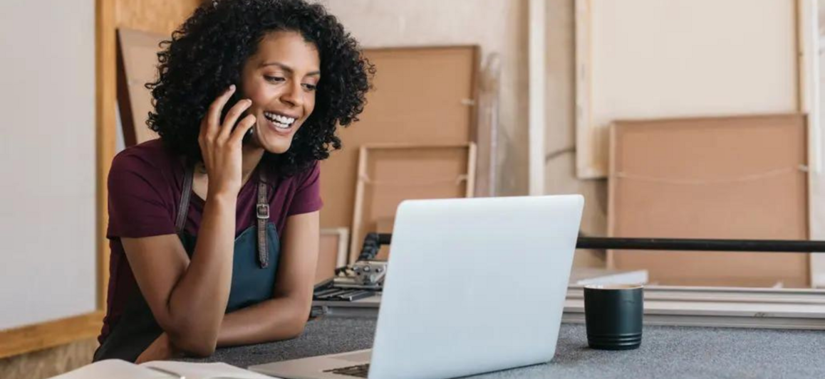 woman smiling at laptop